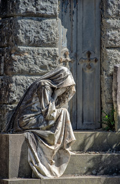 Widow While Crying Marble Statue Outside A Tomb