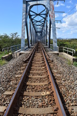 Fototapeta na wymiar 線路（鉄橋付近）／山形県の庄内地方で羽越本線の線路（単線）を撮影したローカルイメージの写真です。赤川（一級河川）に架かる鉄橋付近で撮影した写真になります。