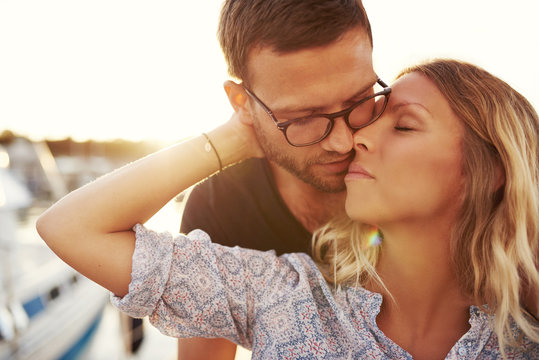 Couple Kissing On A Summer Evening