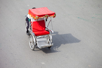 Hanoi, Vietnam, September 30 2014: Life in vietnam- Cyclo beside Sword lake in hanoi, vietnam. Cyclo is the tourist's farvourite vehicle transportation in vietnam