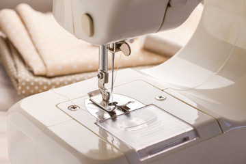 Sewing machine and fabrics in the background