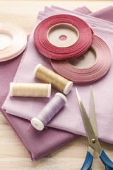 Fototapeta na wymiar Fabrics, threads and ribbons