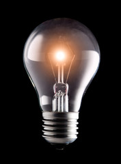 electric light bulb on a black background..