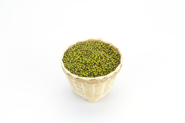 Green bean or mung bean in bamboo basket isolated on white