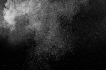 abstract white dust explosion  on a black background. abstract white powder. design elements. abstract texture.