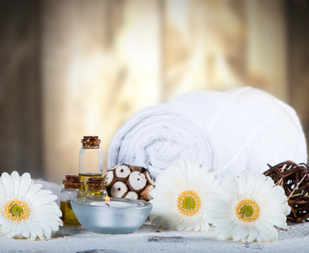 Spa concept, still life with aromatic candles and flower