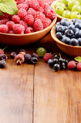 Wooden bowls with organic berries