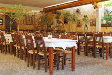Fototapeta na wymiar Mediterranean restaurant terrace exterior with chairs.