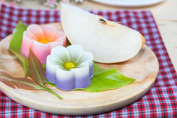 Obraz na płótnie Canvas Thailand tradition ,Flower Dessert Coconut Jelly on wood