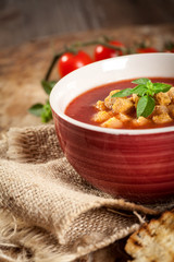 Fresh tomato soup garnished with basil 