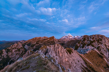 Sunrise in the mountains. Early morning as viewed from the top of Visevnik hill with vast landscape below.