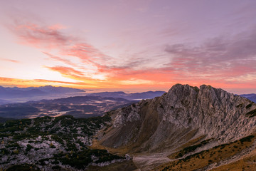 Sunrise in the mountains. Early morning as viewed from the top of Visevnik hill with vast landscape below.