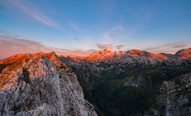 Sunrise in the mountains. Early morning as viewed from the top of Visevnik hill with vast landscape below.