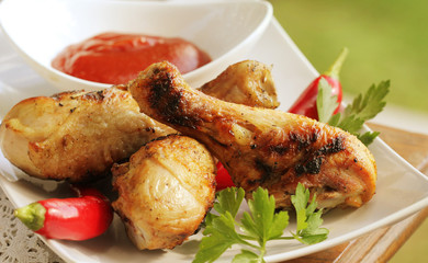 Grilled chicken legs with tomato sauce