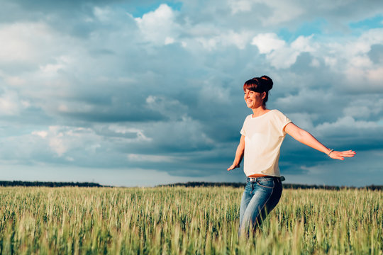 beautiful Russian girl in green field