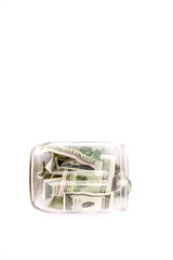 glass jar with dollars