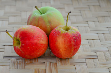 Apple on the bamboo floor.