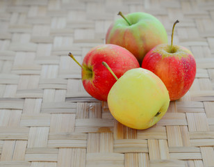 Apple on the bamboo floor.
