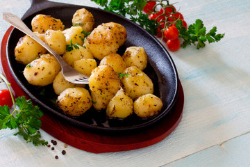 Potatoes on a cast iron skillet in a rustic style