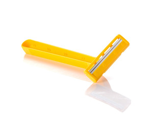 Yellow razor on white background.