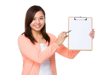 Asian young woman pen point to blank page of clipboard
