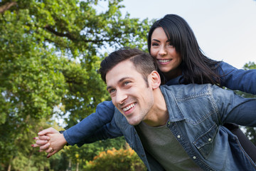 young couple playing flying