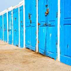 in africa morocco  old harbor wood   door and the blue sky