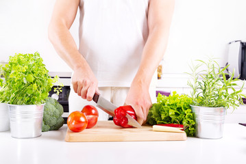 human hands preparing vegetables in the kitchen