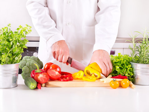 human hands preparing vegetables in the kitchen