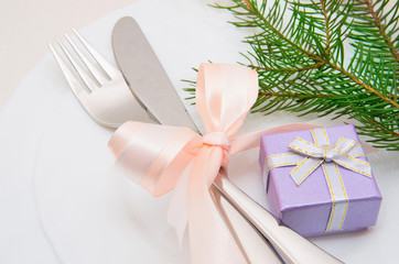 Christmas table place setting with christmas decorations