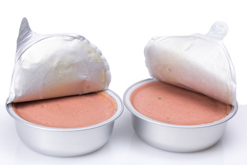 Pate in a metal jar isolated on white