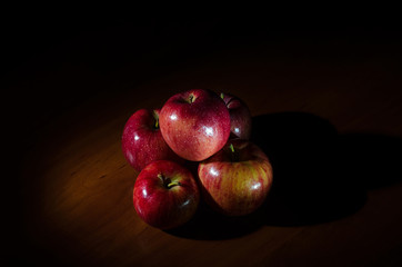 Red, juicy apples with water drops.