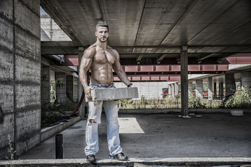 Sexy construction worker shirtless with muscular body