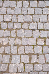 Old grey pavement in a pattern in an old medieval european town.