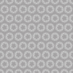Seamless pattern with wreaths of white flowers on a grey background