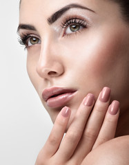 Fototapeta premium Beautiful Young Woman with Clean Fresh Skin. Close up Portrait.