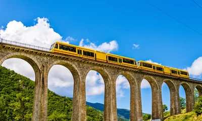 Deurstickers The Yellow Train (Train Jaune) on Sejourne bridge - France, Pyre © Leonid Andronov