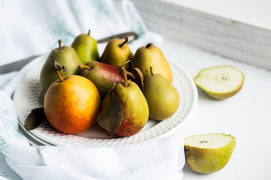 Autumn pears on white pastel background