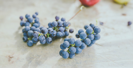 Blue grapes on wood background
