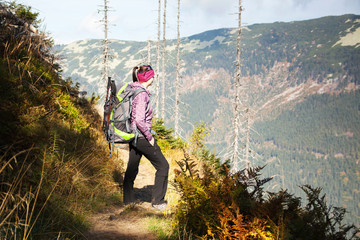 Girl with looks out over the mountains, Czech mountains Krkonose