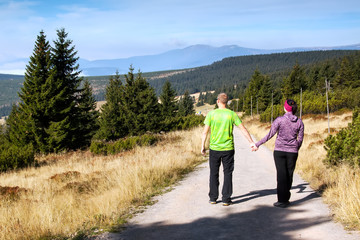 Women and man looks out over the mountains, Krkonose