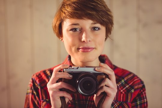  Attractive young woman photographing with camera 