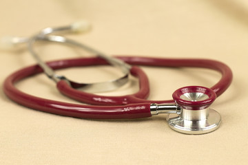 Stethoscope on red background