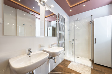 Fototapeta na wymiar Modern bathroom interior with heated towel rail