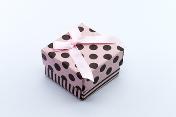 Pink gift box isolated on white background.