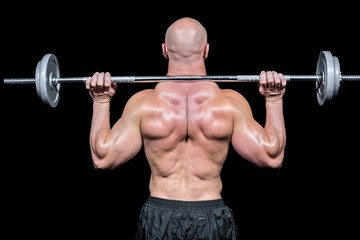 Fototapeta na wymiar Rear view of bodybuilder lifting crossfit