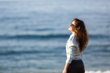 Portrait of a young woman on the seacoast