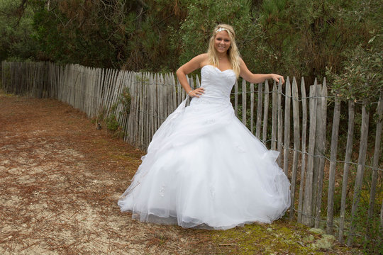 Beautiful and pretty bride with a white wedding dress