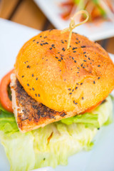 burger with smoked fish and vegetable