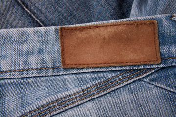 fashionable clothes. pile of jeans on a wooden background